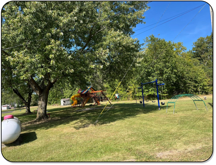Picnic table and firepit at all RV sites at M & M Outdoors Campground.